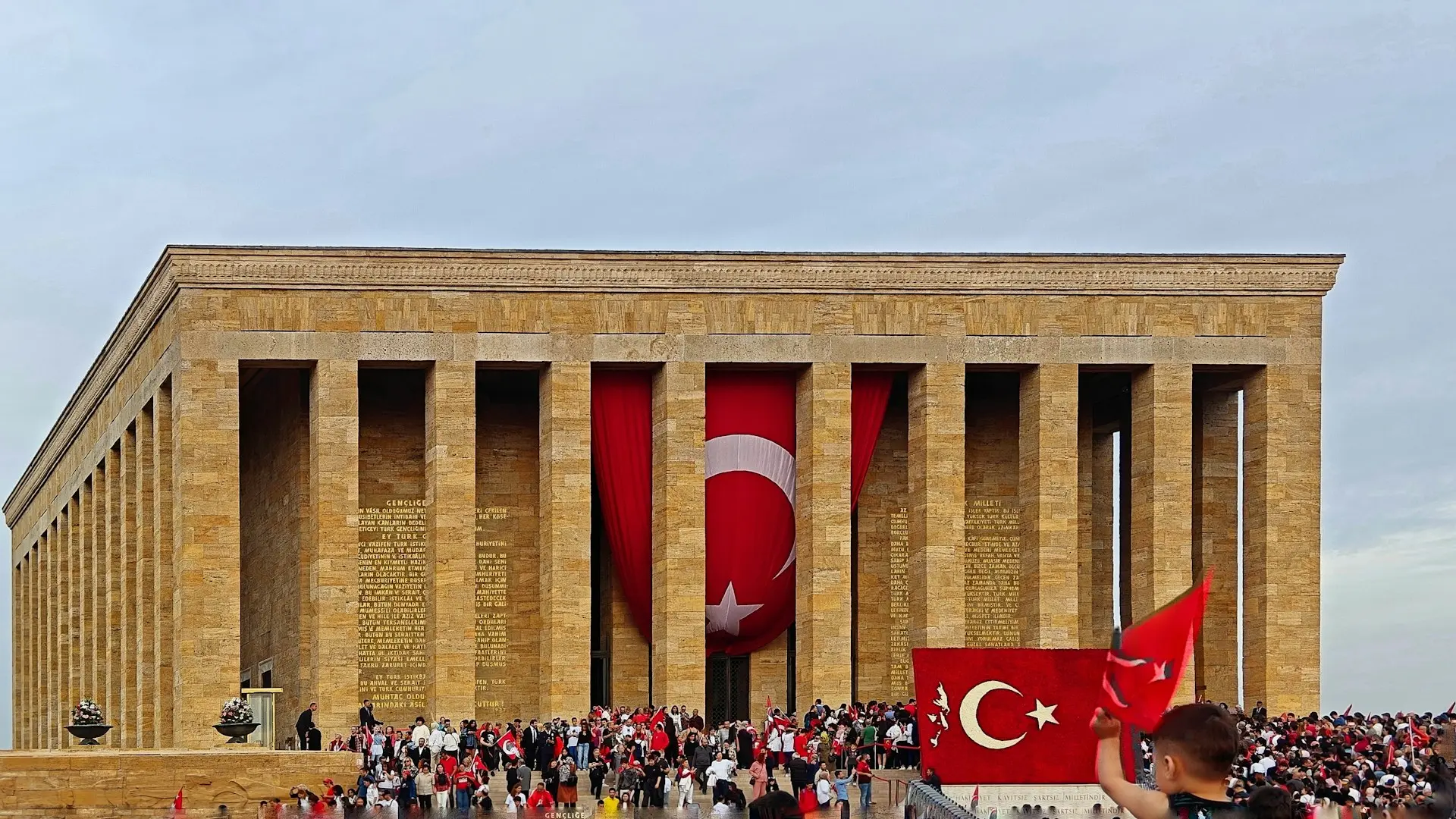 a large group of people standing in front of a building