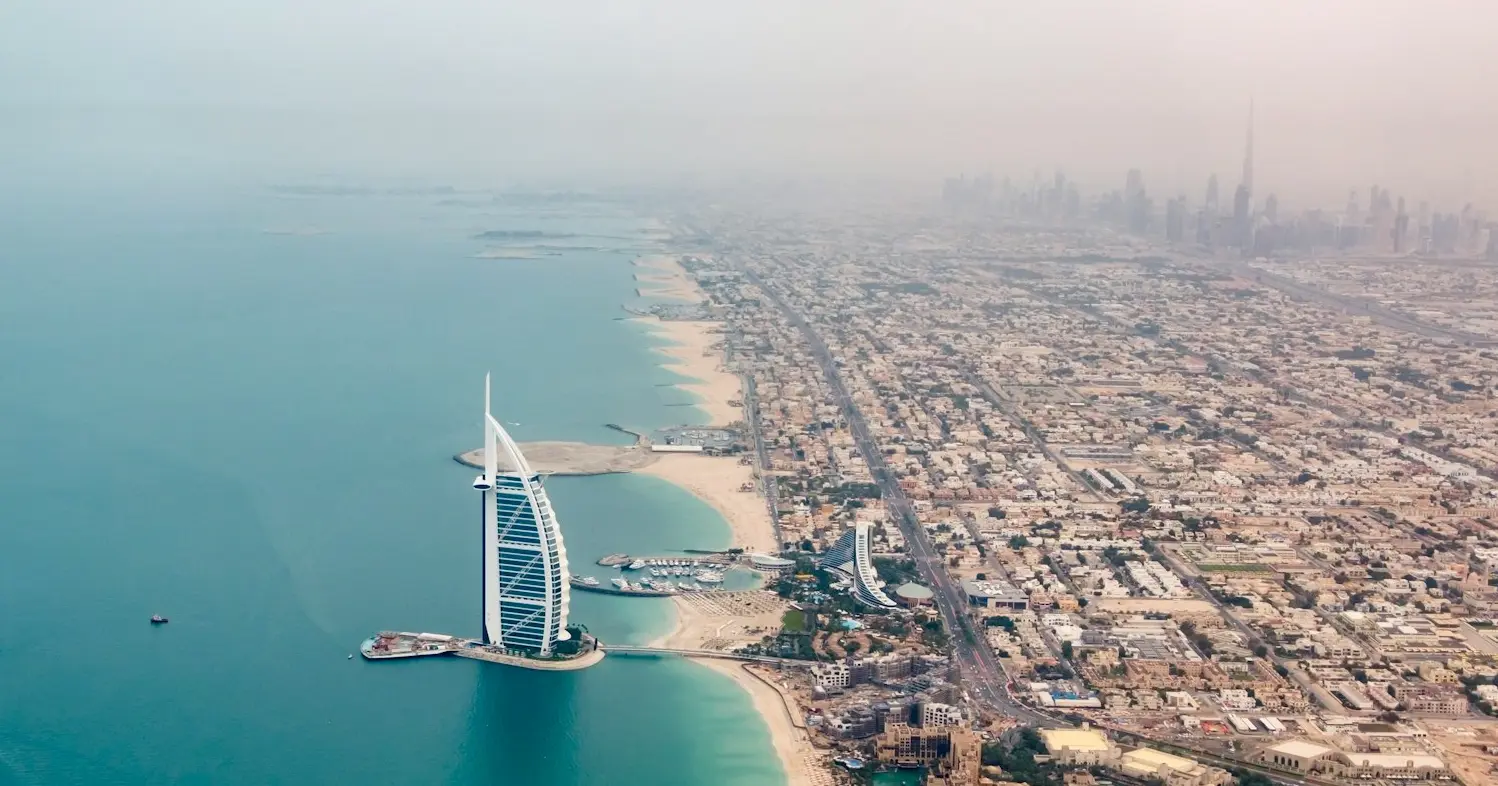 an aerial view of the burj al arab in the middle of the ocean